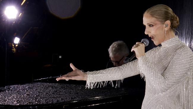 PARIS, FRANCE - JULY 26: (EDITOR'S NOTE: This Handout screengrab was provided by a third-party organization and may not adhere to Getty Images' editorial policy.) This handout released by the Olympic Broadcasting Services, shows a view of singer Celine Dion performing on the Eiffel Tower during the opening ceremony of the Paris 2024 Olympic Games Paris 2024 on July 26, 2024 in Paris, France. (Screengrab by IOC via Getty Images)