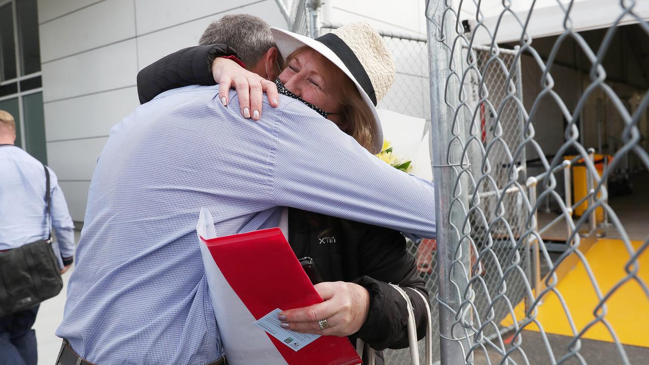 Colin Lester hugging wife Mairi Lester who arrived home. Tasmanian borders open to high risk states once again. Picture: Nikki Davis-Jones