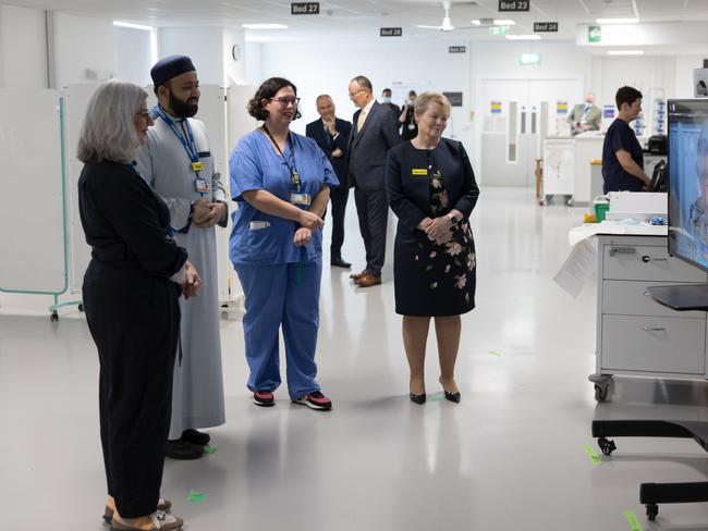 Hospital workers follow the video call with the Queen last Wednesday. Picture: Buckingham Palace via Getty Images