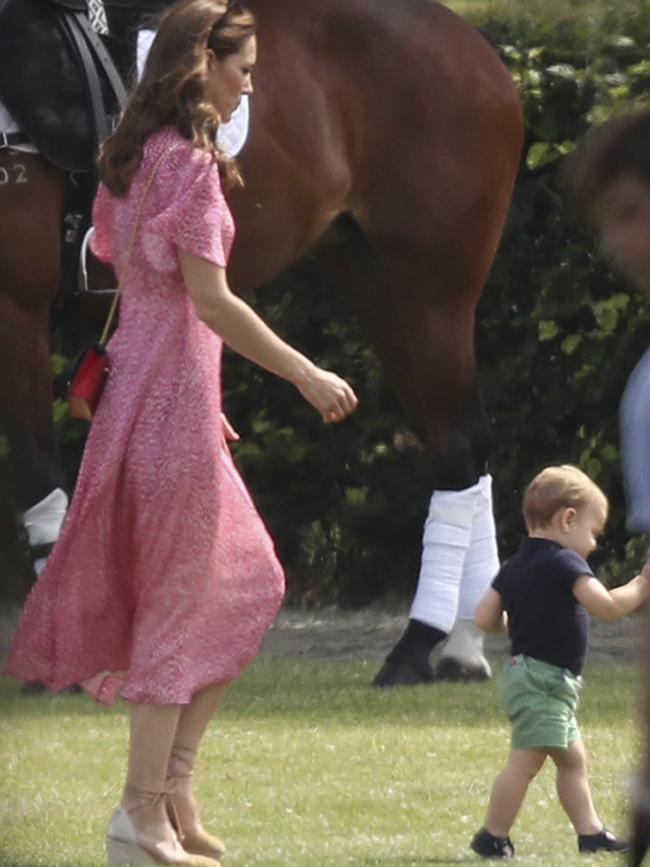 Britain's Kate, Duchess of Cambridge runs after her son Prince Louis. Picture: AP