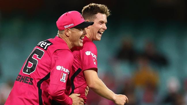 Hayden Kerr celebrates a wicket with Daniel Hughes.