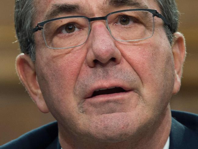 (FILES) This file photo taken on February 25, 2016 shows US Secretary of Defense Ashton Carter as he testifies before the House Appropriations Committee on Capitol Hill in Washington, DC. US Secretary of Defense Ashton Carter has said he opposes high-tech "back doors" that would allow the government access to encrypted data on people's phones and other devices. The Pentagon chief's views come amid a legal battle between Apple and the FBI, which is trying to force the tech giant to help unlock an iPhone used by one of the shooters in the San Bernardino attacks last December. / AFP / JIM WATSON