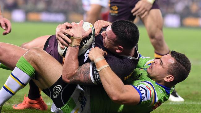 Aidan Sezer of the Canberra Raiders (right) tackles Darius Boyd of the Brisbane Broncos before Boyd scored a try during their Round 14 NRL game at Suncorp Stadium in Brisbane, Thursday, June 9, 2016.(AAP Image/Dan Peled) NO ARCHIVING, EDITORIAL USE ONLY