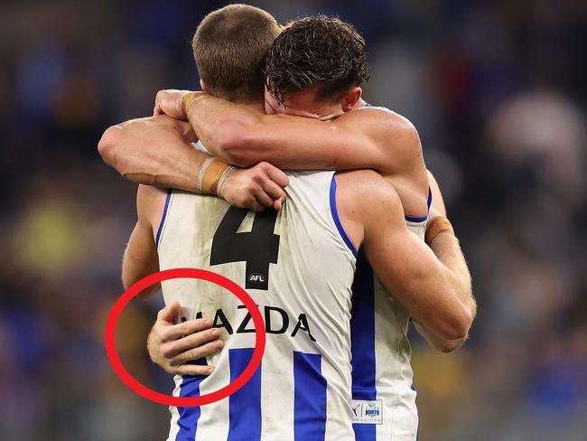 PERTH, AUSTRALIA - JUNE 08: Aidan Corr and Charlie Comben of the Kangaroos celebrate winning the round 13 AFL match between West Coast Eagles and North Melbourne Kangaroos at Optus Stadium, on June 08, 2024, in Perth, Australia. (Photo by Paul Kane/Getty Images)