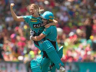 Jemma Barsby and Laura Harris of the heat celebrate winning the WBBL final against the Sydney Sixers. Picture: STEVE CHRISTO