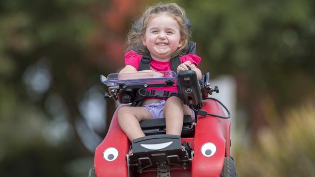 Stephanie uses her wizzybug a motorised wheelchair to zoom around. Picture: Jason Edwards