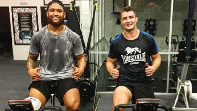 Kieran Foran with Warriors winger Manu Vatuvei.