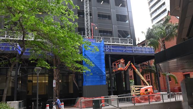 Work has commenced on a replacement of cladding material on the Grenfell Centre office tower. Picture: Keryn Stevens