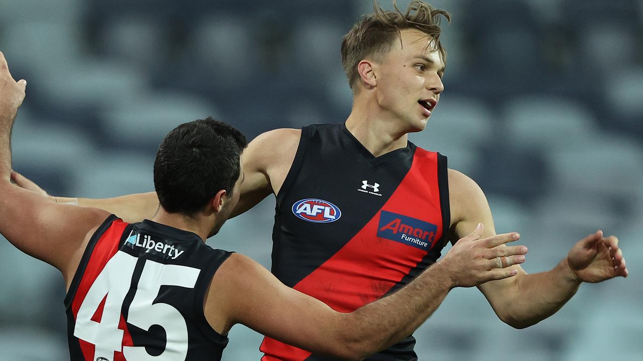 Dylan Clarke celebrates another Essendon goal.