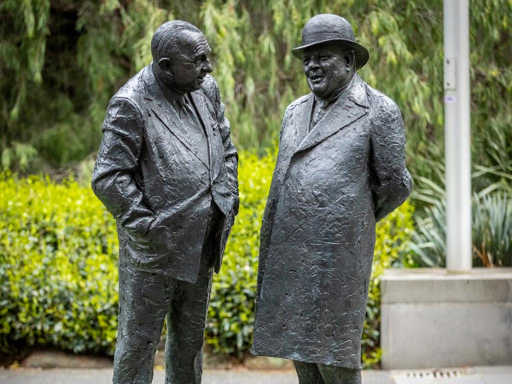 Henry Bolte and Albert Dunstan’s sculptures sit along Treasury Place. Picture: Jake Nowakowski