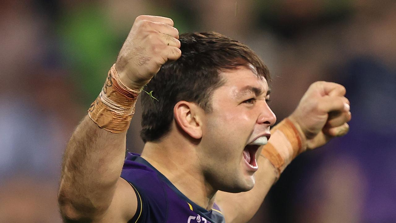 MELBOURNE, AUSTRALIA - APRIL 30: Brandon Smith of the Storm celebrates with teammates after scoring a try during the round eight NRL match between the Melbourne Storm and the Cronulla Sharks at AAMI Park on April 30, 2021, in Melbourne, Australia. (Photo by Robert Cianflone/Getty Images)