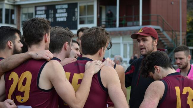 Coach Matt Nicholas calls the shots at the MHSOB huddle