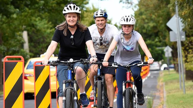 Hilary Marshall (right) with daughter Kaitlyn and husband Brenton enjoying a ride on a protected bike lane. Picture: Josie Hayden