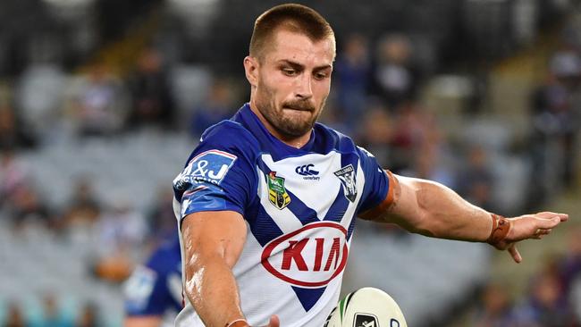 Bulldogs Kieran Foran kicks during the Round 7 NRL match between the Canterbury-Bankstown Bulldogs and the Sydney Roosters at ANZ Stadium in Sydney, Thursday, April 19, 2018. (AAP Image/Mick Tsikas) NO ARCHIVING, EDITORIAL USE ONLY