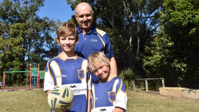 Caloundra State School teacher, Tim Hackney, with rugby league students Harry Coates (left) and Nate Anderson.