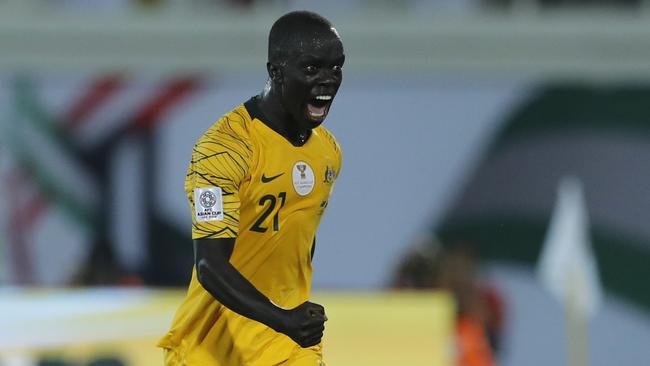 Australia's midfielder Awer Mabil, celebrates his opening goal during the AFC Asian Cup group B soccer match between Australia and Syria at the Khalifa bin Zayed Stadium in Al Ain, United Arab Emirates, Tuesday, Jan. 15, 2019. (AP Photo/Hassan Ammar)