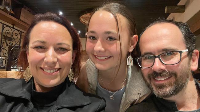 Karla Parry (left) and husband Nathan (right) were stuck in the Westfield North Lakes car park for an hour and a quarter, as they waited to collect their daughter Chaise (middle). Photo: Supplied