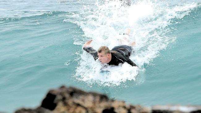 Mick Fanning goes for a surf at Snapper Rocks. Picture: Luke Marsden.