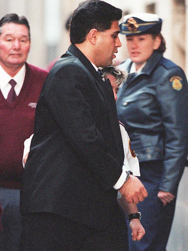 Tony Kellisar is escorted into Supreme Court in Melbourne in 1999. Picture: Simon Dallinger