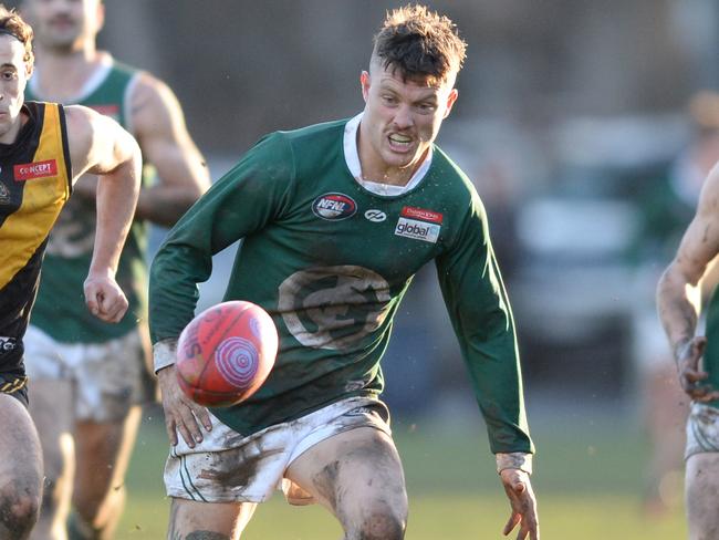 NFL Division 1 Football: Heidelberg v Greensborough at Warringal Park, Heidelberg. Greensborough #12 Ben Fennell leads the chase. Picture: AAP/ Chris Eastman