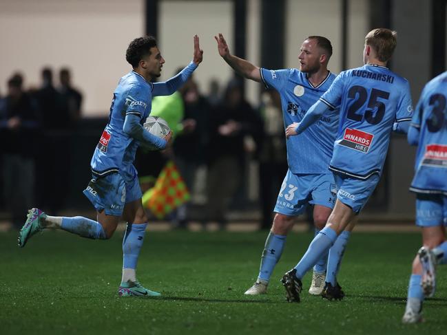 Anas Ouahim (left) is congratulated by Sydney FC teammates after scoring against Oakleigh Cannons. Picture: Daniel Pockett/Getty Images