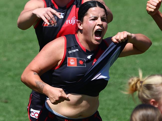 GOLD COAST, AUSTRALIA - OCTOBER 06: Madison Prespakis of the Bombers celebrates a goal during the round six AFLW match between Gold Coast Suns and Essendon Bombers at People First Stadium, on October 06, 2024, in Gold Coast, Australia. (Photo by Chris Hyde/Getty Images)