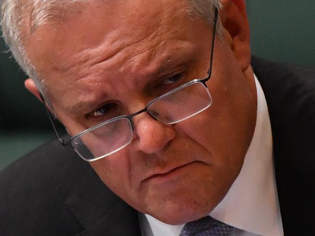 CANBERRA, AUSTRALIA - MARCH 24: Prime Minister Scott Morrison during Question Time in the House of Representatives at Parliament House on March 24, 2021 in Canberra, Australia. On Monday, the federal government was set back by new allegationsÃÂ broadcastÃÂ by the Ten Network after pixelated images of unnamed Coalition advisers allegedly engaging in performing lewd sex acts on the desks of female MPs resulting in a Morrison staff member being sacked last night. Additionally, the ABC Network aired a first hand account by an Australian Parliament security guard of what she witnessed on the night Brittany Higgins was allegedly raped in the office of then-defence industry minister Linda Reynolds in early 2019. (Photo by Sam Mooy/Getty Images)