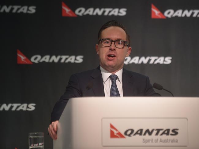 Qantas Chief Executive Officer Alan Joyce announces the airlines annual results in Sydney on August 24, 2016. Australian national carrier Qantas soared to a record annual net profit of 1.08 billion USD in the year to June 30 and announced a first payout to shareholders in seven years in a strong turnaround after major restructuring. / AFP PHOTO / PETER PARKS