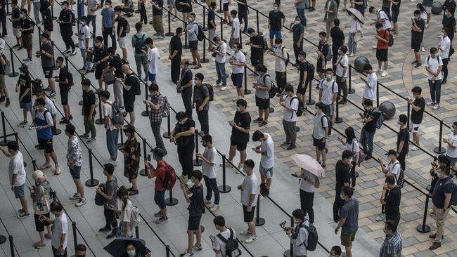 China is battling localised outbreaks of coronavirus around the country, meanwhile the opening of a new Apple store in Beijing attracted a large crowd following social distancing rules. Picture: Getty Images