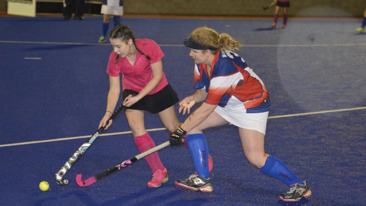 Caitlin Schnitzerling and Celene Keleher in women's Super League hockey action at Queens Park. Picture: Warwick Daily News