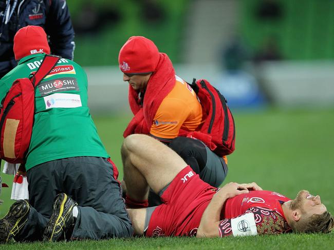 Dom Shipperley is in visible agony as he receives attention on his dislocated ankle.