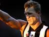 Collingwood v Essendon. MCG. Anzac Day match. Nathan Buckley shields the late afternoon sun from his eyes.