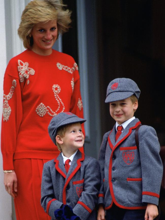 The young princes with their late mother, Princess Diana, with Harry looking up to his big brother William before his first day at school. Picture: Getty