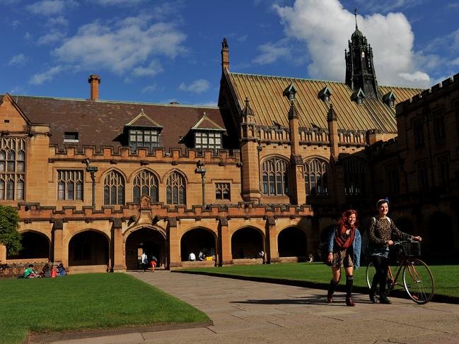 Students walk through The Quadrangle at The University of Sydney, in Sydney on Wednesday, May 8, 2013. (AAP Image/Paul Miller) NO ARCHIVING