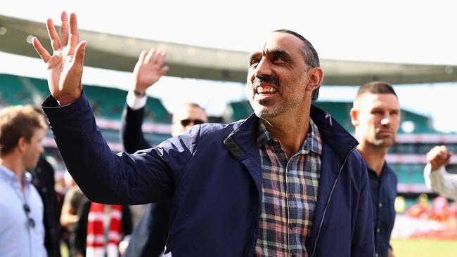 SYDNEY, AUSTRALIA - MAY 07: Former Swan Adam Goodes and team mates from the 2012 Premiership winning team walk a lap of honour during the round eight AFL match between the Sydney Swans and the Gold Coast Suns at Sydney Cricket Ground on May 07, 2022 in Sydney, Australia. (Photo by Cameron Spencer/Getty Images)