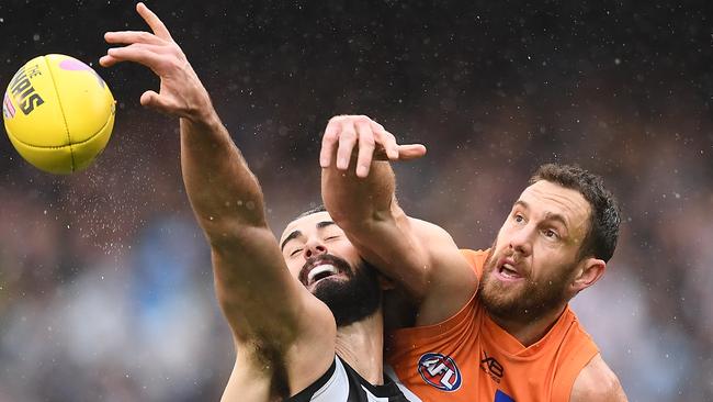 Brodie Grundy and Shane Mumford battle it out at the MCG on Saturday. Picture: Getty Images