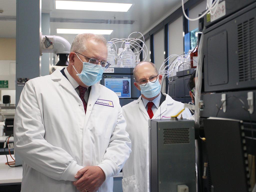 Scott Morrison and Professor Paul Kelly tour an AstraZeneca lab after signing a deal for 25 million vaccines from the British pharmaceutical giant if they prove successful. Picture: Lisa Maree Williams – Pool/Getty Images