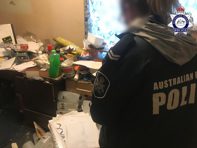 Police officers search the home of Elizabeth man and pedophile Andrew William Richards, who directed the abuse of children in the Philippines via Skype. Picture: AFP