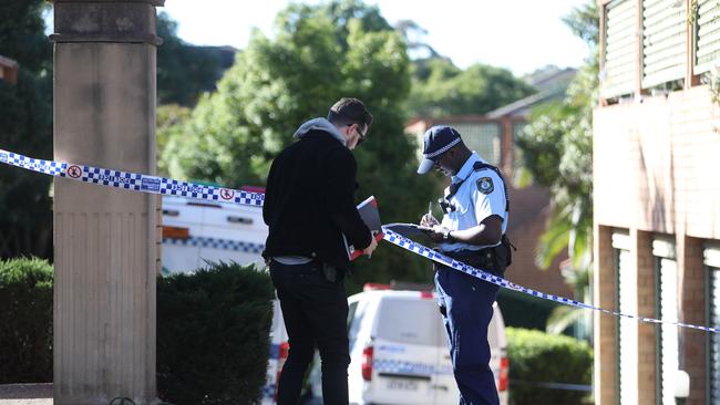 Police block the driveway to the alleged scene of the crime. Picture: John Grainger