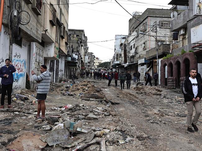 People inspect the damage after an Israeli raid on the Tulkarm camp for Palestinian refugees in the occupied West Bank, during which two men were killed. Picture: AFP