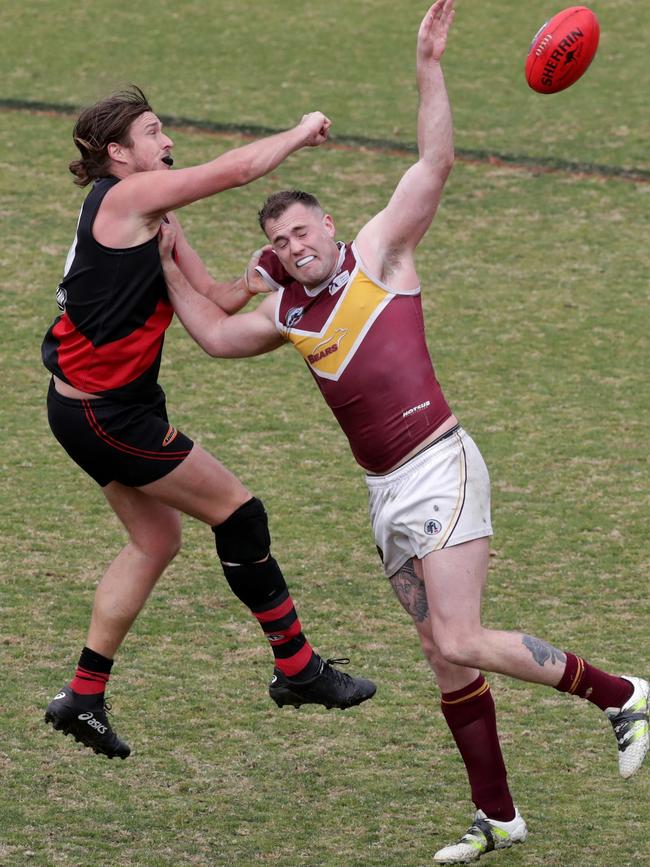 Patrick Flynn battles with Eltham big man Tom Evans. 