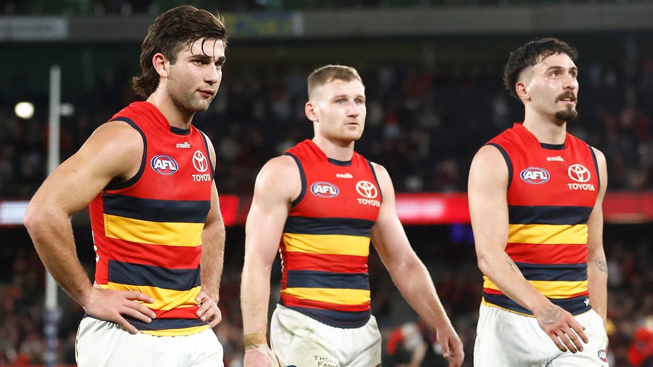 Josh Rachele and his teammates looks dejected after the loss to Essendon. Picture: Michael Willson