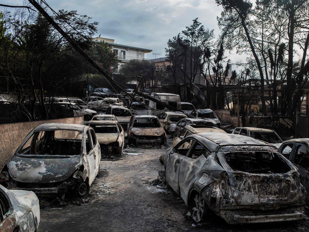 This photo taken on July 24, 2018 show cars burnt following a wildfire at the village of Mati, near Athens, on July 24, 2018. Picture: Angelos Tzortzinis/AFP