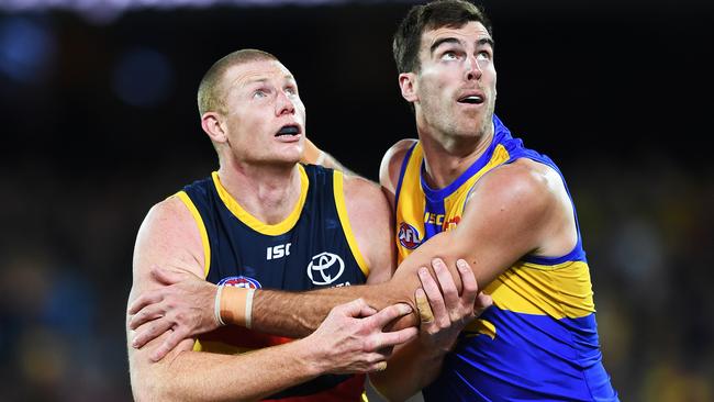 The Crows’ Sam Jacobs competes with one of the Eagles’ two ruckmen, Scott Lycett, during his big game on Saturday. Picture: AAP Image/Mark Brake