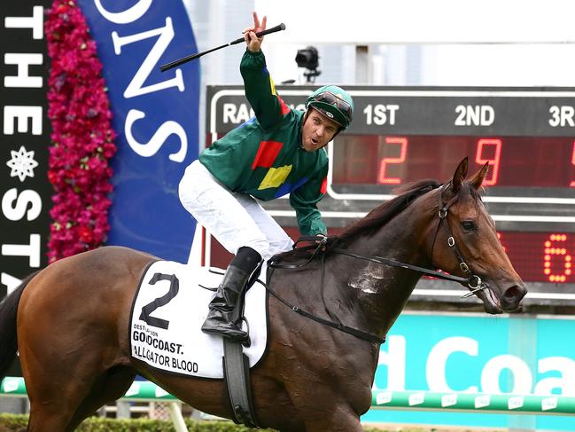 Jockey Ryan Maloney celebrates after riding Alligator Blood to victory in race 6, the Magic Millions 3YO Guineas. (AAP Image/Jono Searle)