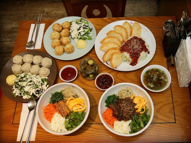 Mandoo restaurant Bank Street, Adelaide. Dishes including Vegetarian bibimbap, Beef bibimbap, Fried and steamed pork dumplings, and bi-bim-mandoo. Picture Dylan Coker