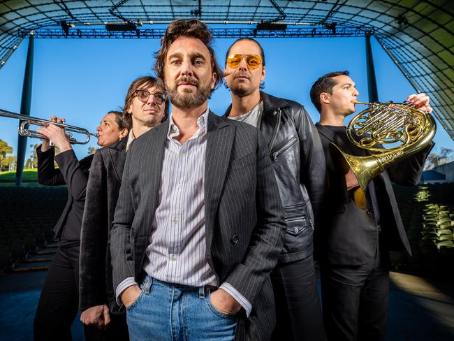 Members of rock band JET, Cameron Muncey, Nic Cester and Mark Wilson are joined by MSO musicians Nico Rosie Turner and Nico Fleury to promote their show at Myer Music Bowl in November. Picture: Jake Nowakowski