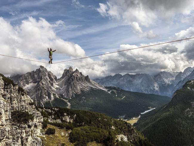 Playing In The Sky ... This is Monte Piana (2324m) in the Italian Dolomites, above the small town of Misurina during the International Highline festival. The mountain is popular with walkers, and in particular slack liners, who come to take advantage of the mountains’ numerous buttresses, suspending thin lines between the spectacular cliffs and then attempting to walk over the gaps. Location: Monte Piana. Picture: James Rushforth (GB)/Siena International Photo Awards 2016
