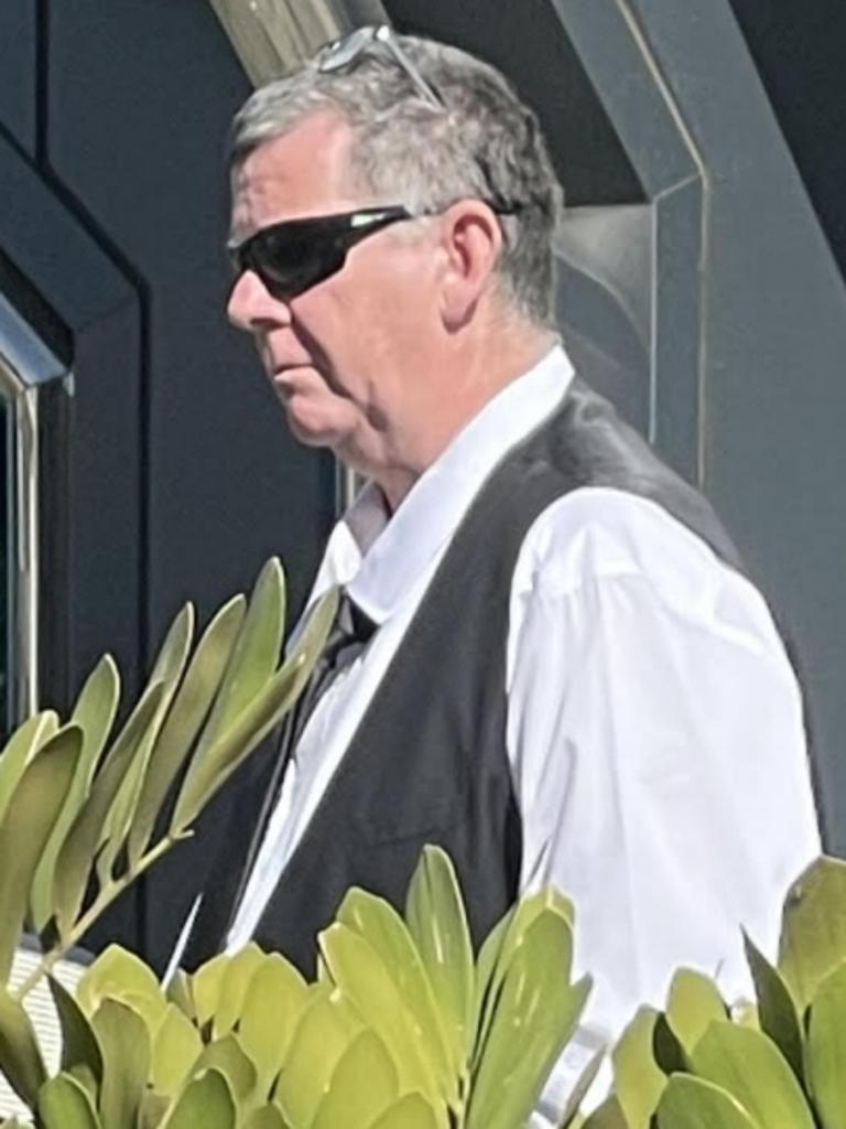 Ashley Allen Dynon speaks with his lawyer outside Toowoomba Courthouse on Monday, August 21, 2023.