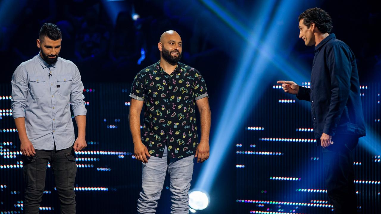 The Cube host Andy Lee with two contestants.